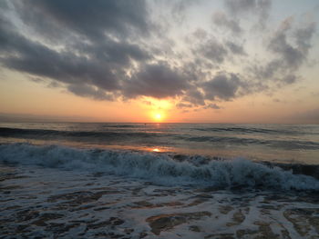 Scenic view of sea against sky during sunset