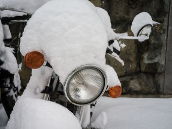 Close-up of human hand on snow