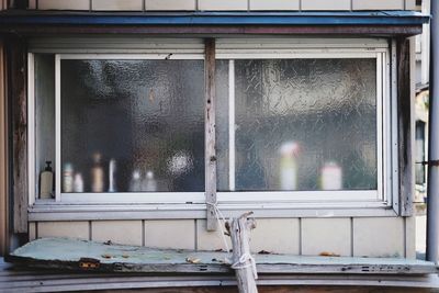 Close-up of water against window