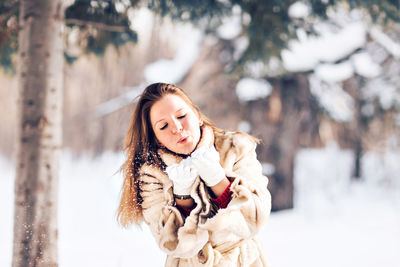 Portrait of woman in snow