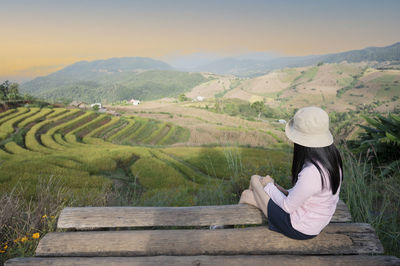 Woman sitting on farm