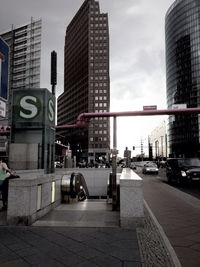 City street against cloudy sky