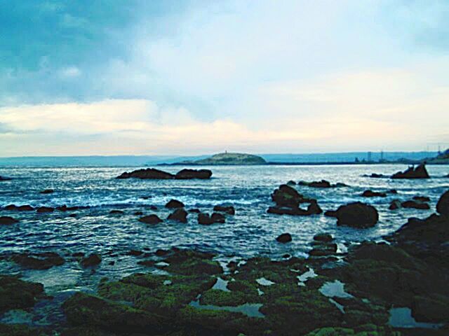 water, sea, sky, horizon over water, scenics, tranquil scene, beauty in nature, rock - object, beach, tranquility, shore, cloud - sky, nature, wave, idyllic, cloud, cloudy, coastline, rock, rock formation