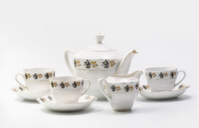 Close-up of tea cup against white background