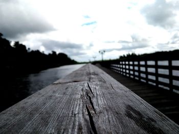 Close-up of footbridge against sky