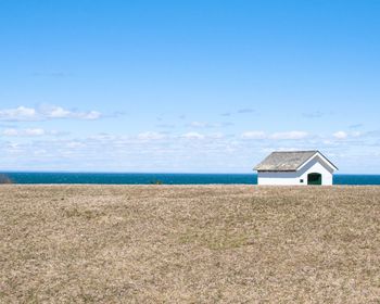 Scenic view of sea against blue sky