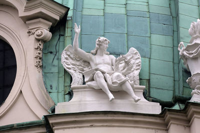 Low angle view of statue against building