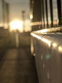 Close-up of illuminated light bulb on table in city