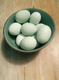 High angle view of eggs in bowl on table