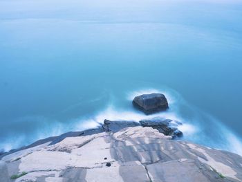High angle view of sea against blue sky
