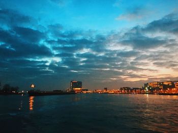 View of illuminated city at sunset