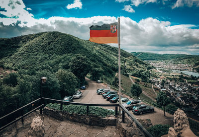 High angle view of flags on mountain against sky