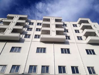 Low angle view of apartment building against sky