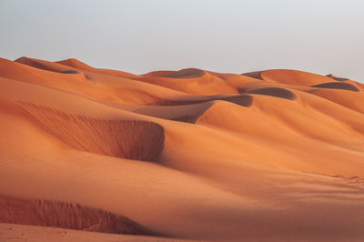 Scenic view of desert against clear sky