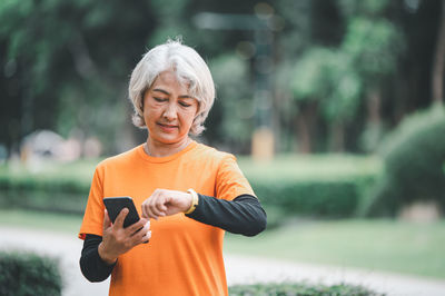 Young woman exercising in park