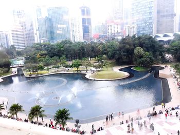 High angle view of people on modern buildings in city