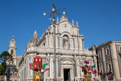 Low angle view of historical building against clear blue sky