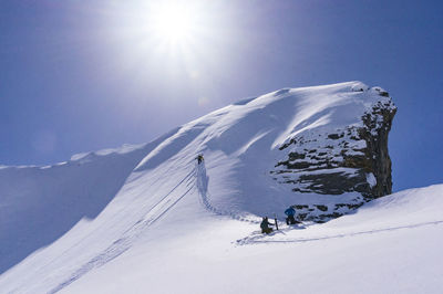 Scenic view of snow covered mountain against sky