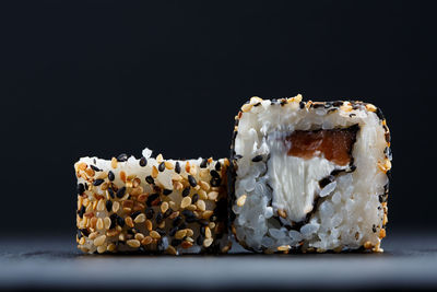 Close-up of cake against black background