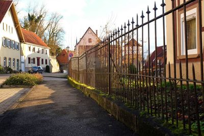 Street amidst buildings against sky