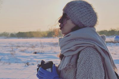 Woman on snow covered landscape