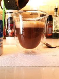 Close-up of coffee served on table at cafe