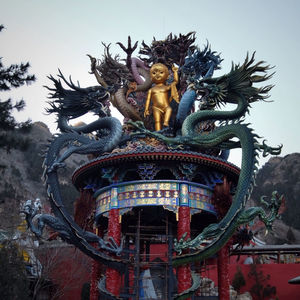 Low angle view of statue against the sky