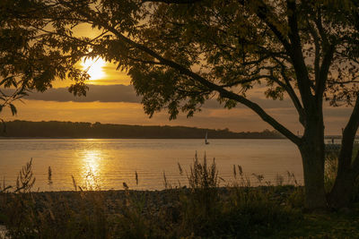 Scenic view of lake against sky during sunset