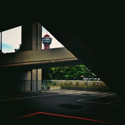 Empty road with bridge in background