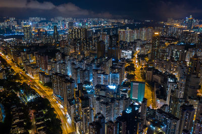 High angle view of illuminated city buildings at night