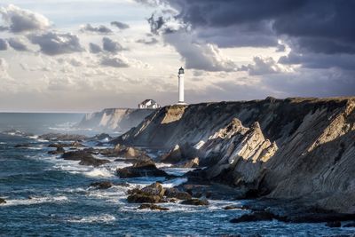 Scenic view of sea against cloudy sky