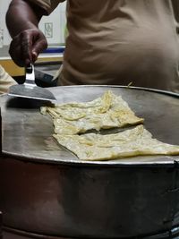 Close-up of person preparing food