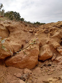 Rock formation on land against sky