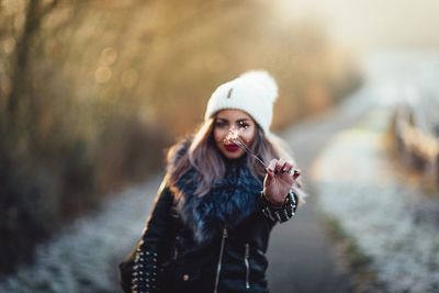 Portrait of smiling woman in snow