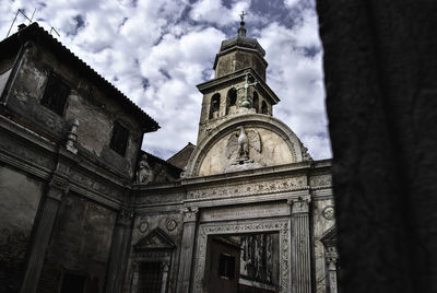 Low angle view of cathedral against cloudy sky