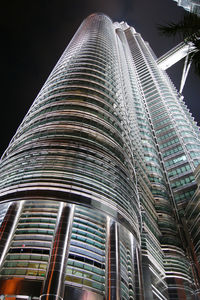 Low angle view of modern building against sky at night