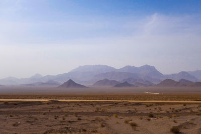 Scenic view of desert mountains against sky
