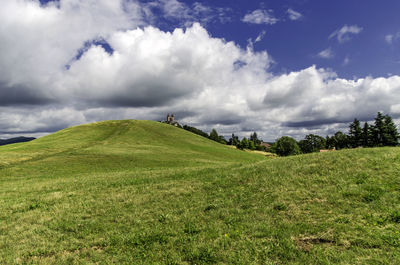 Scenic view of landscape against cloudy sky