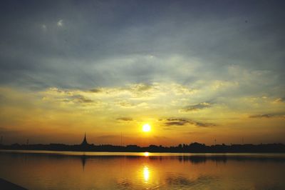 Scenic view of lake against sky during sunset