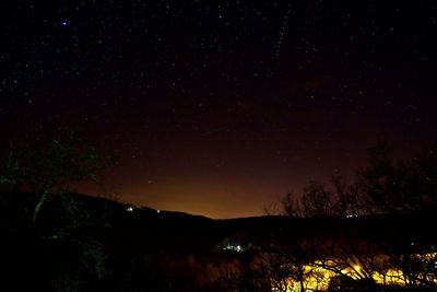 Scenic view of star field against sky at night