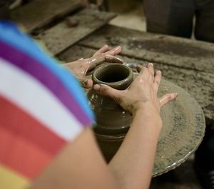 High angle view of hand sculpting claywork