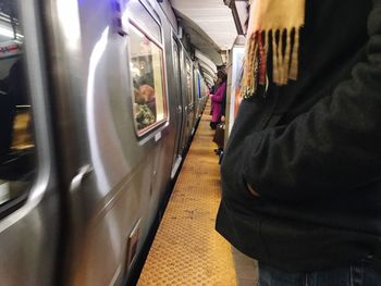 Blurred motion of train at railroad station