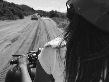 Portrait of woman holding a car