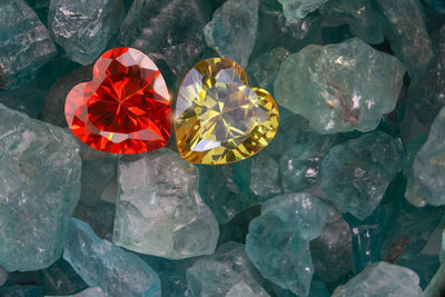 High angle view of red rose on rock