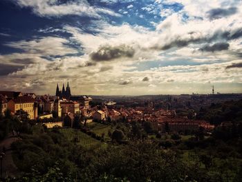 View of town against cloudy sky