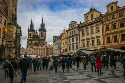 Group of people in front of buildings in city