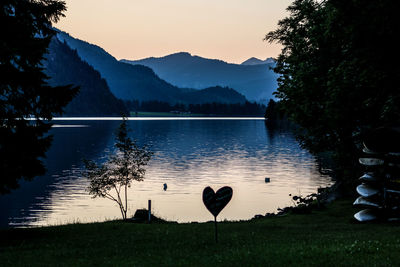 Scenic view of lake against sky during sunset