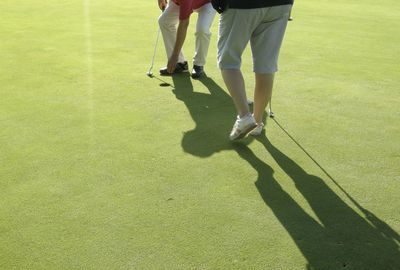 Low section of people playing on golf course