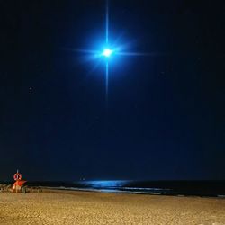 Scenic view of sea against sky at night