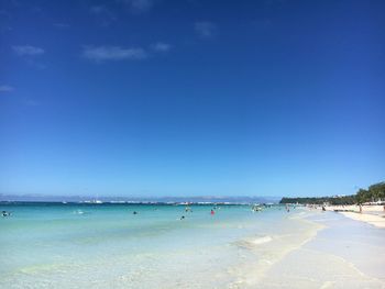 View of beach against blue sky